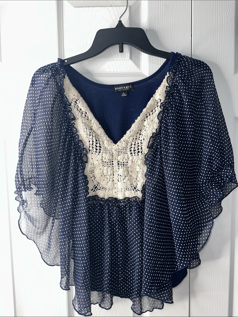 About A Girl Navy Polka Dot Blouse with Cream Crochet V-Neck